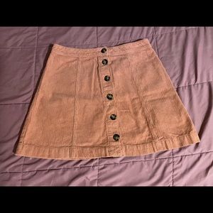 A salmon pink H&M corduroy skirt.
